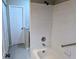 Tiled tub and shower combination with white tile walls in a clean and functional bathroom at 5278 Sabrina Ter, North Port, FL 34286