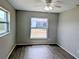 Light-filled bedroom with modern flooring, neutral paint, and double windows at 5278 Sabrina Ter, North Port, FL 34286