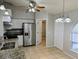 Bright kitchen features stainless steel appliances, granite counters, and neutral tile floors at 5278 Sabrina Ter, North Port, FL 34286