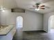Open-concept room featuring modern flooring, an arched doorway, and a granite countertop bar at 5278 Sabrina Ter, North Port, FL 34286
