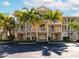 Three-story townhouses with attached garages and balconies at 553 Bahia Beach Blvd, Ruskin, FL 33570
