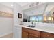 Kitchenette with white countertops and built-in dishwasher at 553 Bahia Beach Blvd, Ruskin, FL 33570