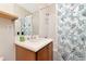 Small bathroom with tub, shower, and seashell-themed decor at 553 Bahia Beach Blvd, Ruskin, FL 33570
