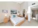 Main bedroom with a queen bed, a sitting area and access to a bathroom at 553 Bahia Beach Blvd, Ruskin, FL 33570