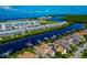 Aerial view of waterfront homes and community with lush landscaping and boat docks at 553 Bahia Beach Blvd, Ruskin, FL 33570