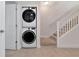 Stackable washer and dryer set in a small laundry area at 553 Bahia Beach Blvd, Ruskin, FL 33570