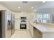 Stainless steel appliances and white cabinets in this galley kitchen at 3702 54Th W Dr # 104, Bradenton, FL 34210