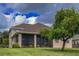 Back view of house with screened porch at 12423 23Rd E St, Parrish, FL 34219