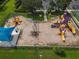 Community playground with play structures and shaded seating at 12423 23Rd E St, Parrish, FL 34219