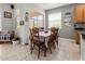 Bright dining area with table and chairs, overlooking backyard at 12423 23Rd E St, Parrish, FL 34219