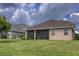 Back view of house, showcasing landscaping at 12423 23Rd E St, Parrish, FL 34219