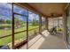 Relaxing screened porch overlooking a pond at 12423 23Rd E St, Parrish, FL 34219