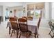 Casual dining area with table and chairs near sliding glass doors at 12423 23Rd E St, Parrish, FL 34219