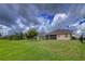 House back view with backyard and pond at 12423 23Rd E St, Parrish, FL 34219