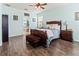 Bright bedroom with wood flooring and en-suite bathroom access at 12423 23Rd E St, Parrish, FL 34219