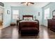 Spacious bedroom with wood flooring and en-suite bathroom access at 12423 23Rd E St, Parrish, FL 34219