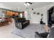 Spacious living room featuring a large sectional sofa and tile flooring at 12423 23Rd E St, Parrish, FL 34219