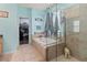 Bathroom with large garden tub and walk-in shower at 12423 23Rd E St, Parrish, FL 34219