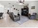 Bright living room with a comfortable seating area and entertainment center at 12423 23Rd E St, Parrish, FL 34219