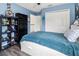 Bright bedroom with built-in shelving and double door closet at 12423 23Rd E St, Parrish, FL 34219