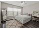 Bedroom with full bed, built-in desk and mirror at 12423 23Rd E St, Parrish, FL 34219