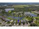 Aerial view of house, community, and lake at 12423 23Rd E St, Parrish, FL 34219