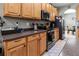 Well-equipped kitchen boasting ample counter space and wood cabinets at 12423 23Rd E St, Parrish, FL 34219