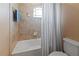 Bathroom with tub and shower, and window at 12423 23Rd E St, Parrish, FL 34219