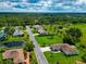 Aerial view showing home's location near water at 225 Brighton Ct, Englewood, FL 34223