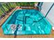 Relaxing hot tub with teal-colored water at 225 Brighton Ct, Englewood, FL 34223