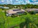 Aerial view showcasing home's pool and backyard oasis at 225 Brighton Ct, Englewood, FL 34223