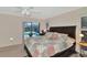 Bedroom with pool view and sliding glass doors at 225 Brighton Ct, Englewood, FL 34223