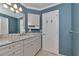 Bathroom with granite countertop, light-colored cabinets and shower/tub combo at 225 Brighton Ct, Englewood, FL 34223