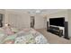 Main bedroom with large TV and ample closet space at 225 Brighton Ct, Englewood, FL 34223