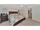 Spacious bedroom with king-size bed and en-suite bathroom access at 225 Brighton Ct, Englewood, FL 34223
