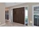 Elegant entryway with double doors and tile flooring at 225 Brighton Ct, Englewood, FL 34223