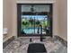 Kitchen sink with view of the pool and lush landscape at 225 Brighton Ct, Englewood, FL 34223