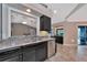 Well-equipped kitchen featuring granite countertops and dark cabinetry at 225 Brighton Ct, Englewood, FL 34223