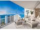 Spacious balcony with comfortable seating and water views at 555 Quay Cmn # 1503, Sarasota, FL 34236