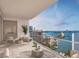 Outdoor balcony with seating and grill, overlooking the bay at 555 Quay Cmn # 1503, Sarasota, FL 34236