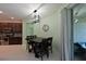 Bright dining area with table and chairs, view into kitchen at 6622 Devesta Loop, Palmetto, FL 34221