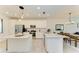 Open concept kitchen with an island and breakfast bar at 18114 Gawthrop Dr # 403, Bradenton, FL 34211