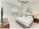 Spacious bedroom with king-size bed, TV, and ample natural light at 18114 Gawthrop Dr # 403, Bradenton, FL 34211