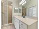 Spa-like bathroom featuring a walk-in shower and a vanity at 18114 Gawthrop Dr # 403, Bradenton, FL 34211