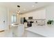 Modern kitchen with island and stainless steel appliances at 18114 Gawthrop Dr # 403, Bradenton, FL 34211