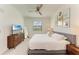 Bright bedroom featuring a king-size bed and stylish dresser at 18114 Gawthrop Dr # 403, Bradenton, FL 34211