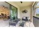 Private balcony with outdoor furniture and golf course views at 18114 Gawthrop Dr # 403, Bradenton, FL 34211