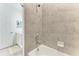 Modern bathroom with a bathtub and large tiled shower at 18114 Gawthrop Dr # 403, Bradenton, FL 34211