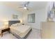 Cozy bedroom with a queen-size bed and stylish decor at 18114 Gawthrop Dr # 403, Bradenton, FL 34211