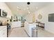 Open concept kitchen with white cabinets and island at 18114 Gawthrop Dr # 403, Bradenton, FL 34211